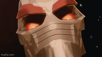 a close up of a robot 's head with red eyes .