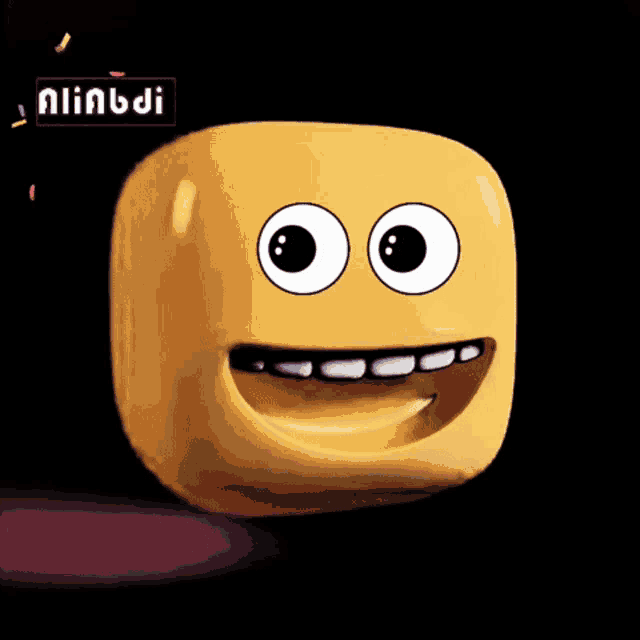 a yellow cube with a smiley face on it and the word aliabdi on the bottom