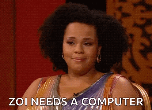 a woman with an afro is sitting in a chair and says zoi needs a computer .