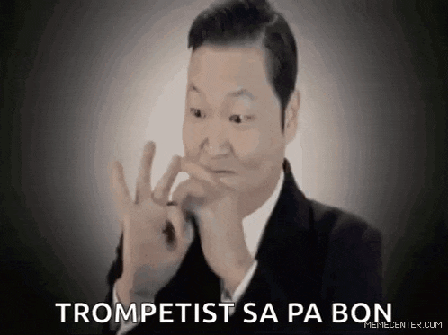 a man in a suit and tie is making a funny face while holding his nose .