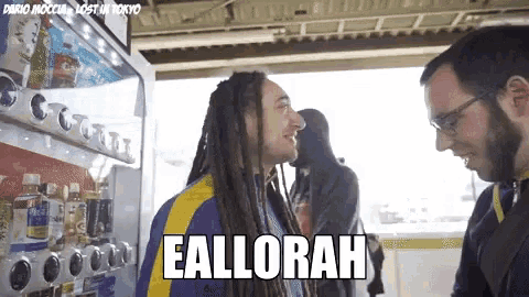 a man with dreadlocks is talking to another man with the word eallorah written on the screen