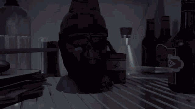 a person is standing in a dark room with a light coming out of the corner .