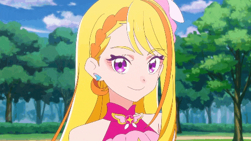 a girl with long blonde hair and purple eyes is smiling