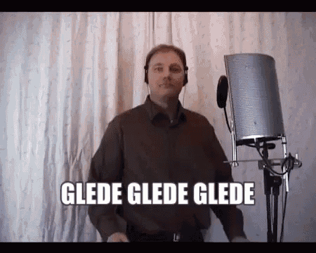 a man wearing headphones is standing in front of a microphone with the words glade glade glade written above him .