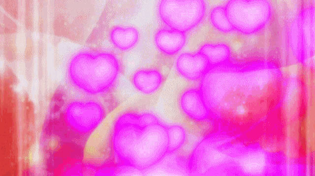 a bunch of pink hearts floating in the air