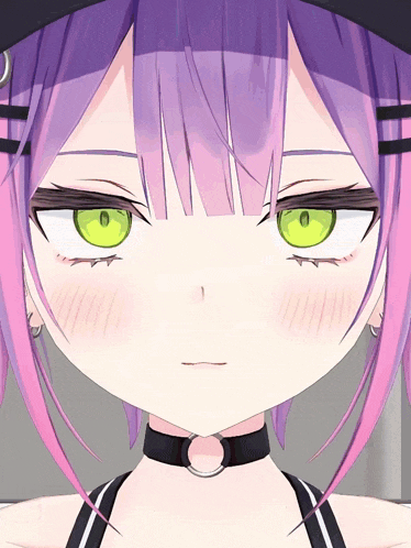 a close up of a girl 's face with green eyes