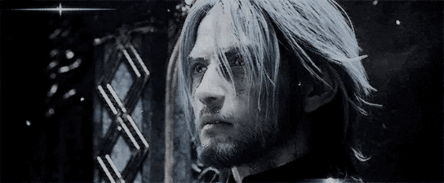 a man with long blue hair and a beard is standing in front of a window .
