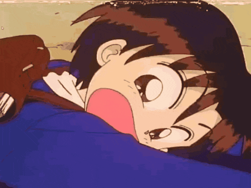 a close up of a cartoon character laying down
