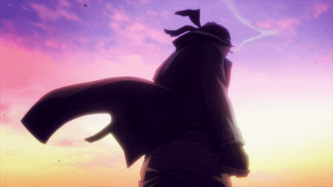 a silhouette of a man standing in front of a purple sky