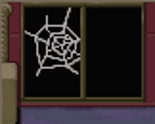 there is a spider web on the window of a building .
