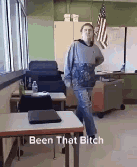 a man is dancing in a classroom with the words been that bitch written below him