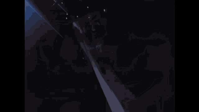 a man in an apron is holding a flamethrower