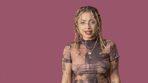 a woman stands in front of a pink background with the words excuse me written on it