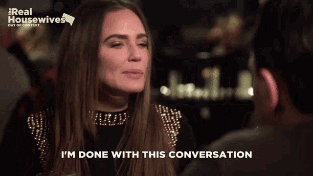 a woman says i 'm done with this conversation in front of a real housewives logo