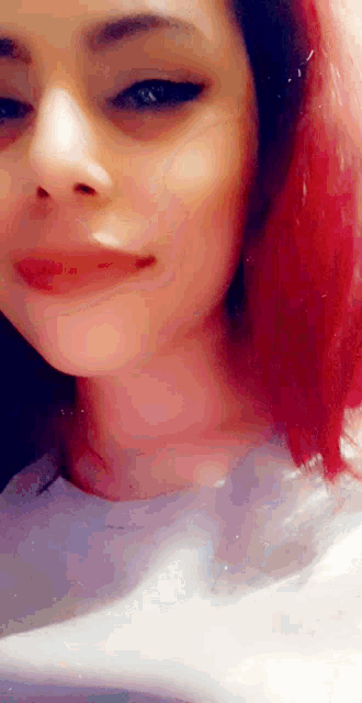 a close up of a woman with red hair