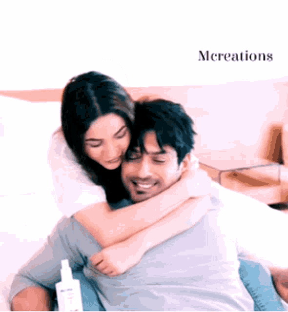 a man is carrying a woman on his back with the word mcreations on the bottom right