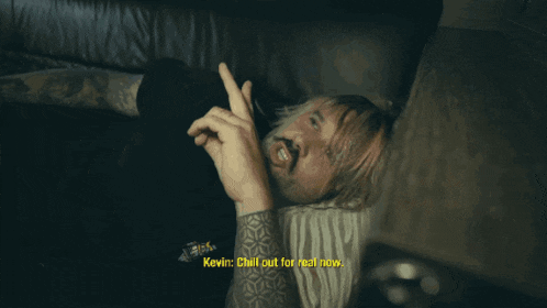 a man laying on a couch with kevin chill out for real now written on the bottom