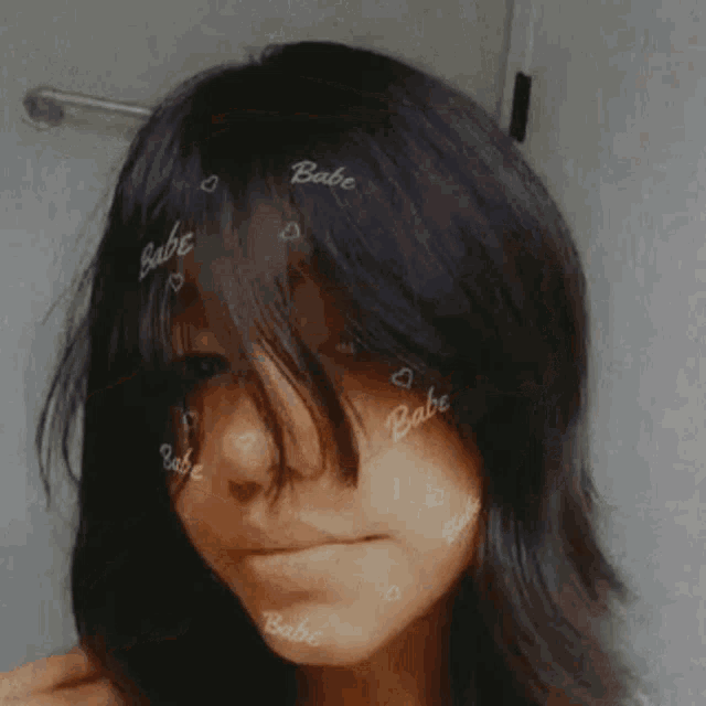 a girl with the word babe written on her forehead