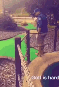 a man standing on a golf course with the words golf is hard