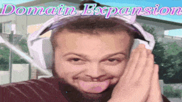 a man wearing headphones is making a funny face with the words domain expansion behind him