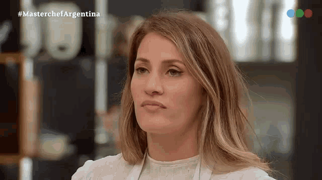 a close up of a woman 's face with the words masterchef argentina on the bottom