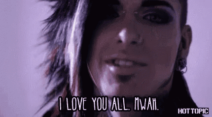 a close up of a person 's face with the words `` i love you all '' written on the bottom .
