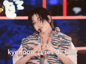 a man with a microphone in his mouth says kyehoon
