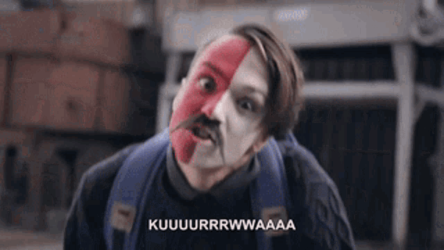 a man with half of his face painted red and white with the words kuuuurrwwaaa on the bottom