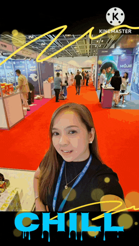 a woman stands in front of a red carpet with the word chill in blue letters