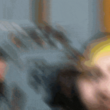 a blurry picture of a person with a yellow headband on
