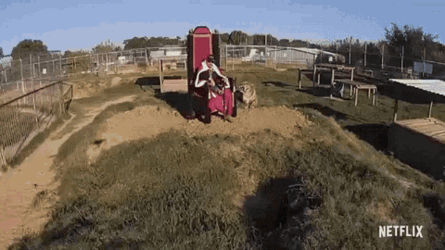 a netflix ad shows a man sitting in a chair in the dirt