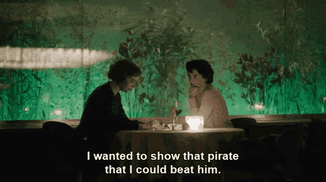 two people sitting at a table with the words i wanted to show that pirate that i could beat him on the bottom right