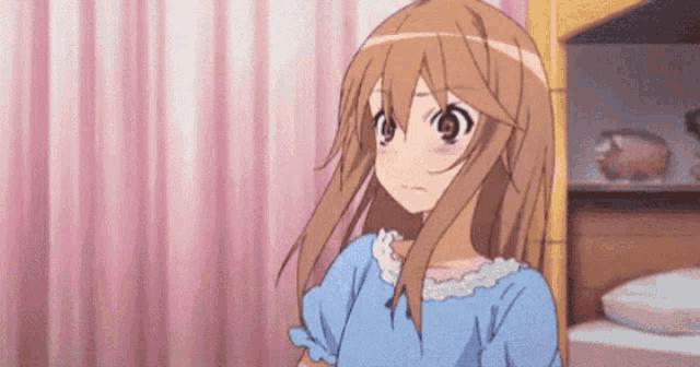 a girl with long brown hair is wearing a blue dress and standing in front of a pink curtain .