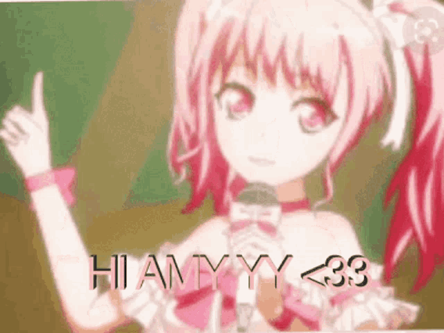 a pink haired anime girl is holding a microphone and pointing at something .