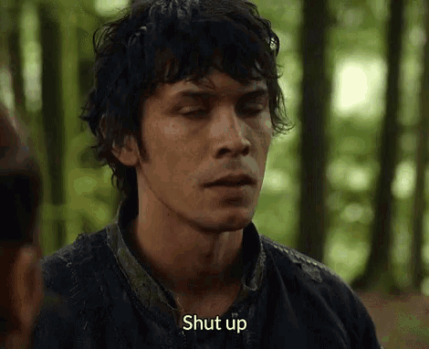 a man is standing in the woods and saying shut up