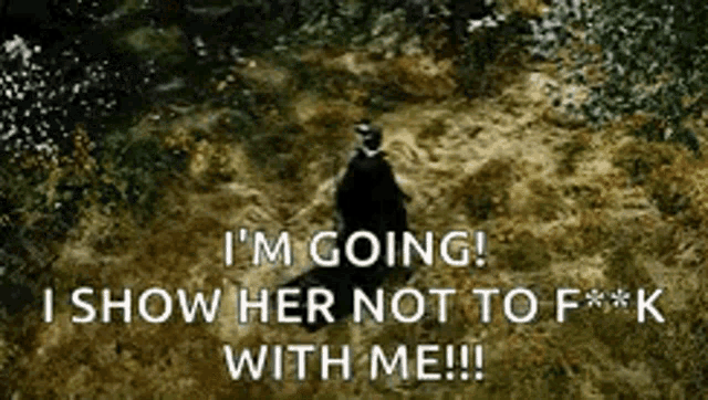a person standing in the grass with a caption that says i 'm going i show her not to f * * k with me