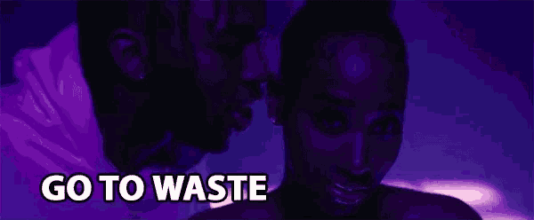 a man and a woman are looking at each other and the words go to waste are on the screen