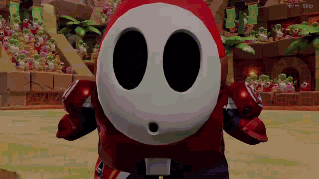 a video game character named shy guy is standing in a stadium