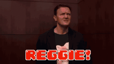 a man is making a funny face in front of a red background that says reggie