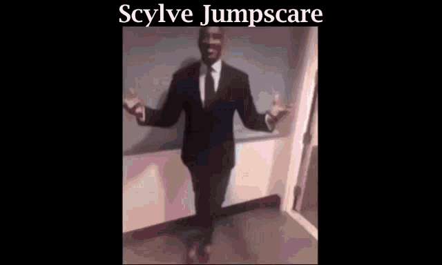 a man in a suit is dancing in a hallway .
