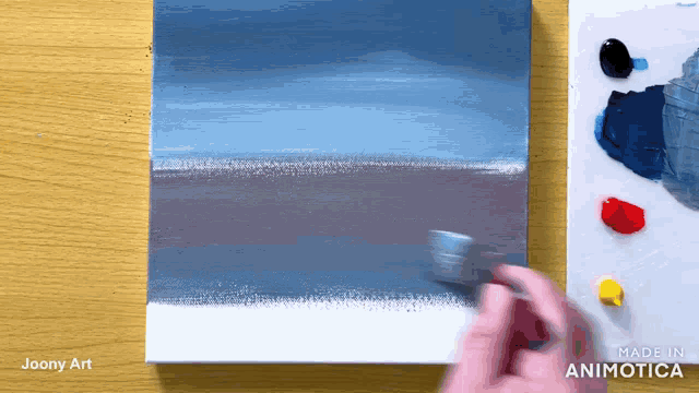 a painting is being painted on a canvas with the words made in animatica on the bottom