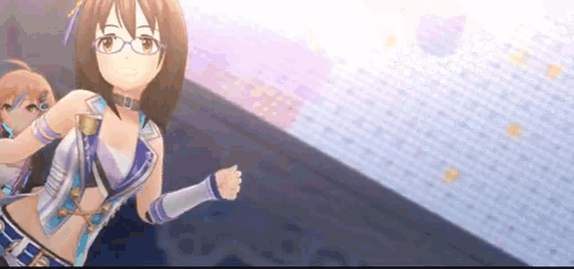a girl with glasses is standing on a stage in front of a crowd .