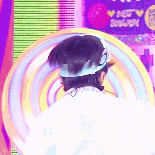 a person wearing a white shirt with the word nct on the back