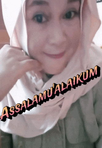 a woman wearing a hijab with the words assalamu'alaikum written on her face