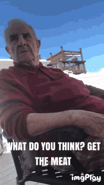 a man in a red shirt is sitting in a chair with the words what do you think get the meat