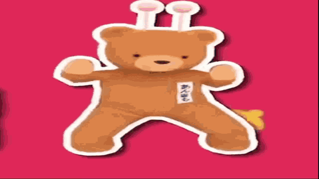 a brown teddy bear with a sticker on its chest that says ' a ' on it
