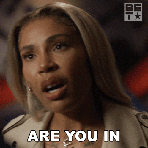 a woman says are you in in front of a be tv logo