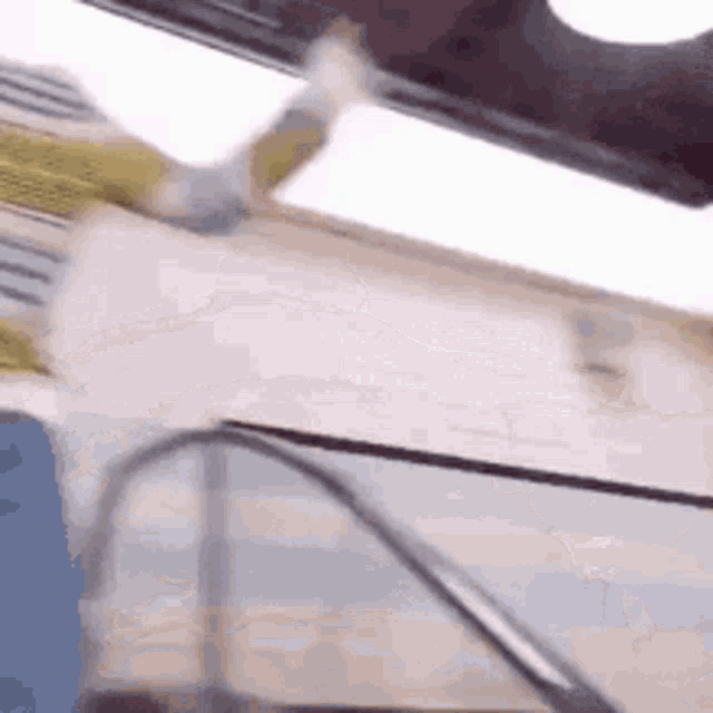 a person is walking down an escalator in a building .
