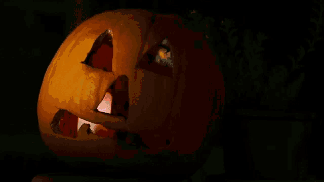 a carved pumpkin with a face carved into it