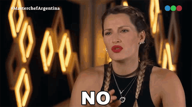a woman says no in front of a blurred background